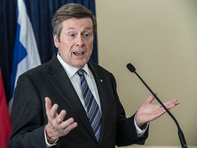 Mayor John Tory responds to questions from the media during a press conference at City Hall on Feb. 27, 2015. (Craig Robertson/Toronto Sun)