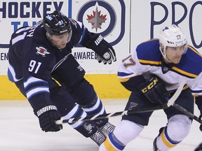 Winnipeg Jets center Jiri Tlusty (l) chases down St. Louis Blues left winger Jaden Schwartz during NHL hockey in Winnipeg, Man. Thursday, February 26, 2015.
Brian Donogh/Winnipeg Sun/QMI Agency