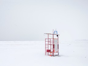 A lifeguard station is the only colour in an otherwise white-washed scene as snow and ice cover the beach and Lake Erie at Port Stanley. (CRAIG GLOVER, The London Free Press)