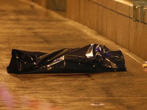 A view shows the covered body of Boris Nemtsov, who was shot dead, in central Moscow February 28, 2015. (REUTERS/Maxim Shemetov)