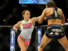 Cat Zingano (left) fights Amanda Nunes during a bantamweight bout in UFC 178 at MGM Grand Garden Arena. (Stephen R. Sylvanie/USA TODAY Sports)