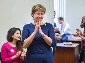 Wanda Morris, CEO, Dying With Dignity Canada, reacts to the news that the Supreme Court of Canada struck down the ban on doctor assisted suicide at her office in Toronto on February 6, 2015. (Ernest Doroszuk/QMI Agency)