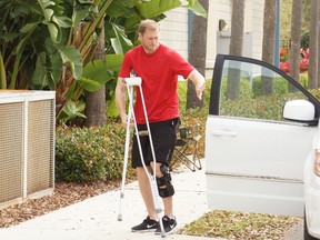 Blue Jays’ Michael Saunders arrives at the team’s complex prior to his surgery on the torn meniscus in his left knee. The doctor removed the injured part of the meniscus. (Eddie Michels/photo)