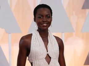 Actress Lupita Nyong'o wears a Calvin Klein gown and Chopard diamonds as she arrives at the 87th Academy Awards in Hollywood, California in this February 22, 2015 file photo. (REUTERS/Mario Anzuoni/Files)
