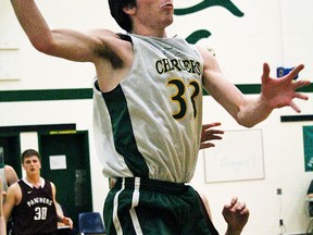 Zack Mullins of CSS in action against PECI during the COSSA AA senior boys basketball final Friday at Centennial.