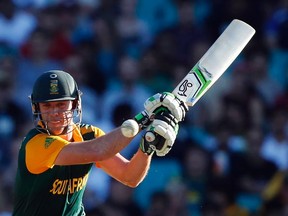South Africa’s AB de Villiers smashes a shot during the Cricket World Cup match against the West Indies at the Sydney Cricket Ground. He finished with 162 runs, which included eight sixes and 17 fours, in his team’s 257-run victory. (JASON REED/Reuters)
