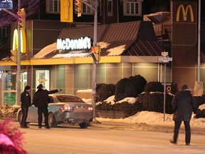 Police at the scene of a double homicide inside at McDonalds on Danforth Ave. near Coxwell Ave. (JOHN HANLEY/Special to the Toronto Sun)