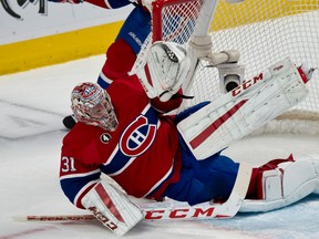 Canadiens goalie Carey Price dives to make a save against the Leafs on Saturday night. (QMI AGENCY)
