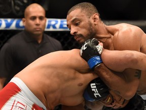 Roan Carneiro grapples with Mark Munoz in their middleweight bout during the UFC 184 event at Staples Center. (Harry How/AFP)