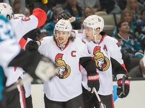 Feb 28, 2015; San Jose, CA, USA; Ottawa Senators defenseman Erik Karlsson (65) celebrates with teammates after scoring a goal against the San Jose Sharks during the second period at SAP Center at San Jose. Mandatory Credit: Ed Szczepanski-USA TODAY Sports