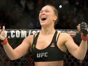 Ronda Rousey reacts after defeating Cat Zingano during their women's bantamweight title bout at UFC 184 at Staples Center. (Jayne Kamin-Oncea/USA TODAY Sports)