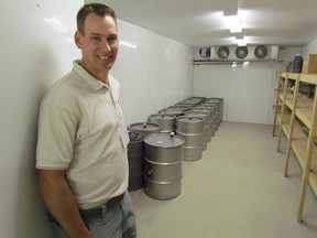 Ryan Vandenberg is shown in the file photo in the doorway of the cold storage room at his Forest-area maple syrup operation, Ryan's Sweet Maple. Cold temperatures have left Lambton County maple syrup producers waiting, so far this year. FILE PHOTO/THE OBSERVER/ QMI AGENCY