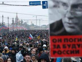 People march to commemorate Kremlin critic Boris Nemtsov, who was shot dead on Friday night, in central Moscow on Mar. 1, 2015. (REUTERS/Sergei Karpukhin)