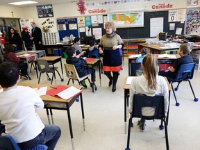 Students listen to teacher Susan Parisi on Tuesday February 24, 2015 in her Grade 6 class at St. Thomas Aquinas Elementary School in Georgina, Ont., which is among the fastest improving schools in York Region. Michael Peake/Toronto Sun/QMI Agency