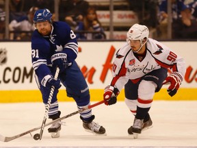 Washington Capitals’ Marcus Johansson strips the puck off Phil Kessel during the third period at the Air Canada Centre in Toronto on Thursday January 8, 2015. (Jack Boland/Toronto Sun)