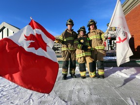 Chris Fedor, Michelle Allan (c), and Courtney Polson (r) pose in their tent on the roof of station 2 in February 2014. Perry Mah/Edmonton Sun/QMI Agency