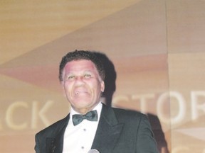 London tap dancer, singer and conga player Joey Hollingsworth receives a lifetime achievement award from Black History Month co-ordinating committee Saturday at the closing gala at Wolf Performance Hall. (JOE BELANGER, The London Free Press)