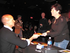 Author Craig Shreve shares a light moment with Shauna Thompson during a book-signing at the Chatham Cultural Centre. Shreve’s first novel, “One Night in Mississippi,” was officially launched on Saturday.