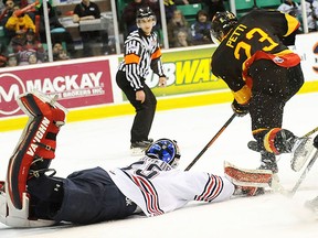 Belleville's Niki Petti beats Oshawa Jeremy Brodeur during OHL action Saturday night at Yardmen Arena. (Don Carr for The Intelligencer)