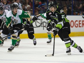 The Edmonton Oil Kings' Edgars Kulda (23) battles the Prince Albert Raiders' Dalton Yorke (5) during second period WHL action at Rexall Place, in Edmonton Alta., on Sunday March 1, 2015. David Bloom/Edmonton Sun/QMI Agency