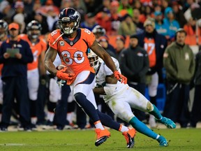 Wide receiver Demaryius Thomas #88 of the Denver Broncos turns for yardage after a catch against the Miami Dolphins at Sports Authority Field at Mile High on November 23, 2014 in Denver, Colorado.  Doug Pensinger/Getty Images/AFP