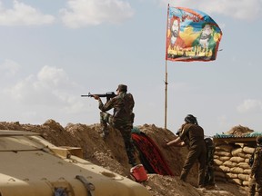 Shi'ite fighters clash with Islamic State militants at Udhaim dam, north of Baghdad, March 2, 2015. Iraq's armed forces, backed by Shi'ite militia, attacked Islamic State strongholds north of Baghdad on Monday as they launched an offensive to retake the city of Tikrit and the surrounding Sunni Muslim province of Salahuddin. REUTERS/Thaier Al-Sudani