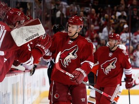 Zbynek Michalek #4 of the Arizona Coyotes celebrates with teammates on the bench after scoring a first period goal against the Anaheim Ducks during the NHL game at Gila River Arena on December 27, 2014 in Glendale, Arizona.  (Christian Petersen/Getty Images/AFP)