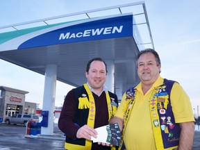 Exeter Lions Club President Chris Keller and Conservation Dinner Committee Chairman Paul Anstett, also of the Exeter Lions, hold up four $50 gift cards courtesy of MacEwen Petroleum Inc. This $200 value in gas and C-Store items is the Early Bird Prize for the Conservation Dinner 2015. People who purchase their ticket early (by March 6) to the gala charitable dinner and auction have a chance to be drawn as the winner of the Early Bird Prize Draw.