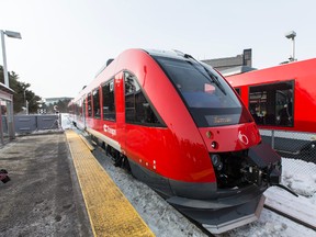 One of the new O Train's rolls into the Carleton University stop after switching problems caused lenghy delays in there official launch. March 2, 2015. Errol McGihon/Ottawa Sun/QMI Agency