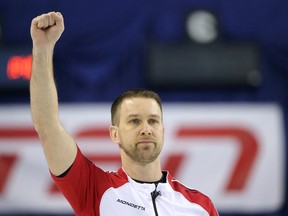 Team Newfoundland/Labrador skip Brad Gushue pumps a fist after making his final shot against Team Canada at the 2015 Tim Horton's Brier in Calgary, Alberta, on  Sunday March 1, 2015. Team NL beat Team CA 9-7. Mike Drew/Calgary Sun