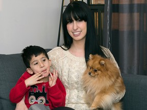 Genevieve Trepanier with her 4-year-old son Anthony and dog Bear. Photo taken on Monday, March 2, 2015 in Ottawa, Ont.
(DANI-ELLE DUBE/Ottawa Sun/QMI AGENCY)