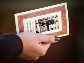 A woman holds a memorial pamphlet outside the public visitation for Cpl. Nathan Cirillo outside a funeral home in Hamilton, October 27, 2014. Top Canadian security officials are due to testify on Monday before a parliamentary committee about threats facing the nation following last week's attack on Parliament by a man described as a homegrown radical. Their testimony comes a day after police said Michael Zehaf-Bibeau, the man who killed a Canadian soldier Cpl. Nathan Cirillo and attacked the Parliament building, made a video of himself just before the attack that contained evidence that he was driven by ideological and political motives.  REUTERS/Mark Blinch