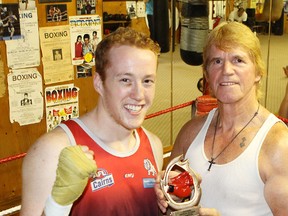 Kingston Youth Boxing Club fighter J.D. Firth, left, is among the boxers that trainer Colin MacPhail, right, will likely take to a card in Syracuse next month. (Whig-Standard file photo)