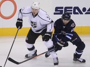 Michael Frolik (right) is a big part of what the Jets are doing this season but he remains an unrestricted free agent who could sign elsewhere in the summer if the Jets can't get him to re-sign.