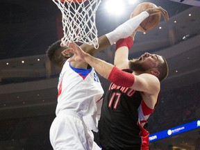 76ers'  Nerlens Noel  blocks the shot of Raptors' Jonas Valanciunas on Monday night at the Wells Fargo Center in Philadelphia. (USA TODAY SPORTS/PHOTO)
