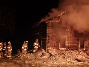 Fire crews knock down the flames at a vacant home on Dwyer Hill Rd., in the city's rural southwest end on Tuesday morning. (TODD HORRICKS Ottawa Fire Service)