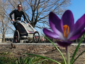 A mother and her child run along side the Rideau Canal in Ottawa, Ont., in this April 22, 2013 file photo. A late spring is expected for most of Canada, according to The Weather Network's spring outlook. (Tony Caldwell/QMI Agency Files)