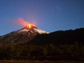 Ash and lava spew from the Villarrica volcano, as seen from Pucon town in the south of Santiago, March 3, 2015. Volcano Villarrica in southern Chile erupted in the early hours of Tuesday, sending a plume of ash and lava high into the sky, and forcing the evacuation of nearby communities. REUTERS/Lautaro Salinas
