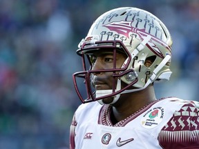Quarterback Jameis Winston #5 of the Florida State Seminoles looks on during the College Football Playoff Semifinal against the Oregon Ducks at the Rose Bowl Game presented by Northwestern Mutual at the Rose Bowl on January 1, 2015 in Pasadena, California. (Jeff Gross/Getty Images/AFP)