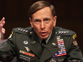 U.S. General David Petraeus gestures during the Senate Intelligence Committee hearing on his nomination to be director of the Central Intelligence Agency in Washington, in this file photo taken June 23, 2011. (REUTERS/Yuri Gripas/Files)
