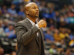 Denver Nuggets coach Brian Shaw watches during NBA play against the Oklahoma City Thunder at Pepsi Center Oct. 8, 2014.  (Chris Humphreys/USA TODAY Sports)