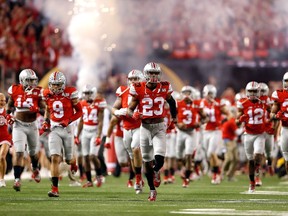 The Ohio State Buckeyes take the field prior to the College Football Playoff National Championship Game against the Oregon Ducks at AT&T Stadium on January 12, 2015 in Arlington, Tex. (Christian Petersen/Getty Images/AFP)