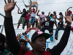 Demonstrators gesture and chant as they continue to react to the shooting death of Michael Brown in Ferguson, Missouri, in this August 2014 photo. (REUTERS/Lucas Jackson)