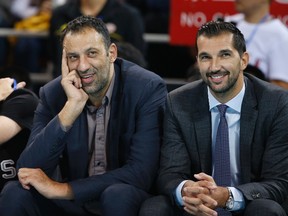 Former NBA players Vlade Divac (L) and Peja Stojakovic watch the NBA Global Games between Sacramento Kings and Brooklyn Nets in Beijing October 15, 2014. (REUTERS)