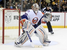 New York Islanders goalie Chad Johnson looks on during NHL play against the Pittsburgh Penguins at the CONSOL Energy Center. (Charles LeClaire/USA TODAY Sports)