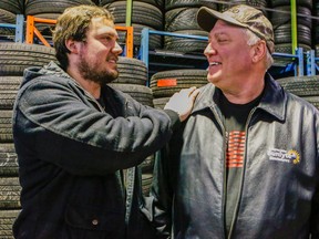 Dennis Kenny, right, is thanked by Tires Tires owner Diego Catala at his Eddystone Dr. shop in the Jane St. and Finch Ave. area of Toronto Tuesday March 3, 2015. (Dave Thomas/Toronto Sun)