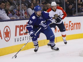 Toronto Maple Leafs forward Phil Kessel (81) looks to pass the puck as Florida Panthers defenceman Steven Kampfer (3) defends during the second period at the Air Canada Centre Feb 17, 2015. (John E. Sokolowski-USA TODAY Sports/Reuters)