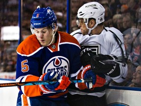 Mark Fayne collides with Kings forward Marion Gaborik during the last meeting between the two teams in December. The Kings have been struggling this season to stay in the playoff picture. (Codie McLachlan, Edmonton Sun)