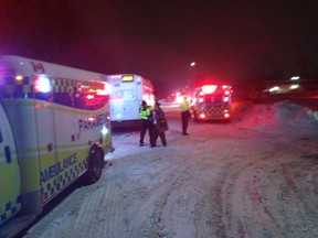 Emergency vehicles are on the scene of a major fire on Compton Street on Tuesday night. (Elliot Ferguson/The Whig-Standard)