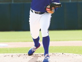 Jays ace R.A. Dickey throws a pitch during Monday’s intrasquad game. (STAN BEHAL/Toronto Sun)